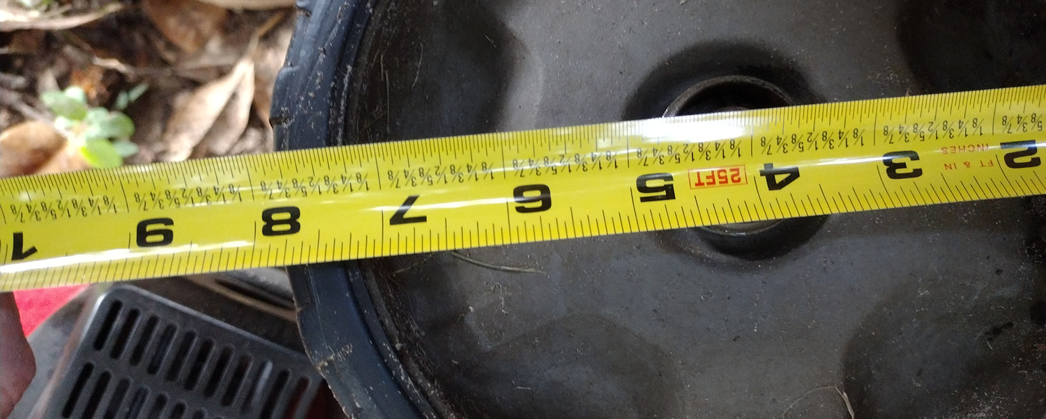 Measure the front drive wheel with a tape measure. This lawn mower wheel is 8 inches.